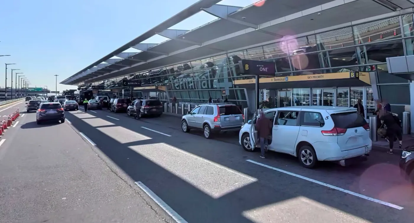 JFK Terminal 4 departures curb and terminal exterior, photographed in June 2019