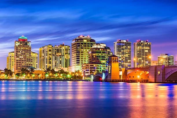 West Palm Beach waterfront buildings and bridge at dusk